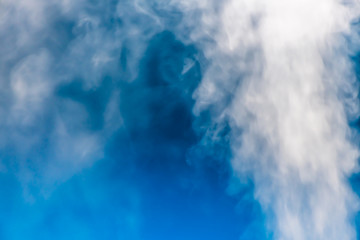 closeup steam from the air humidifier on blue background. health, disease prevention