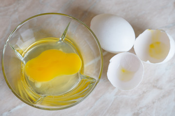 Beat eggs in a transparent plate,