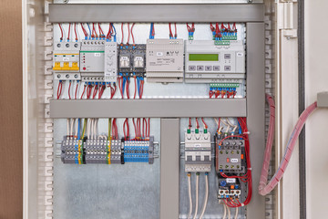 Control relay with screen, power supply, contactor or starter with thermal relay, circuit breakers, terminals, phase and voltage monitoring relays, intermediate relays in the electrical Cabinet.