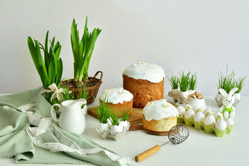 Easter sweet bread, Easter cake with green grass. Holidays breakfast concept with copy space. Easter greeting card template. Homemade pasques.Easter sweets on white background.
