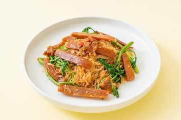 Stir-fried rice vermicelli and water mimosa with pickled squid