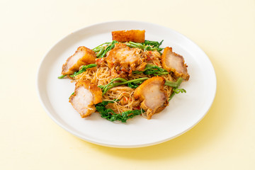 Stir-fried rice vermicelli and water mimosa with crispy pork belly