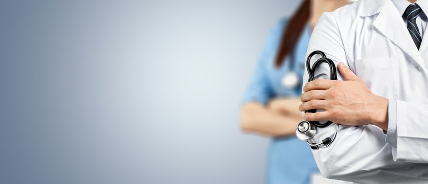 Doctor team with medical stethoscope on background