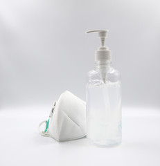 Alcohol Gel Hand and Disposable Hygienic or medical Mask for hand hygiene corona virus protection on white background . 