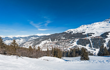 Panoramic view across snow covered alpine mountain range