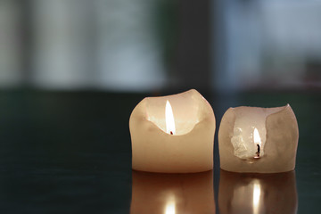 two white candles in the dark soft lens background