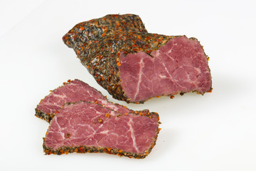 Tasty meat sausages over white background