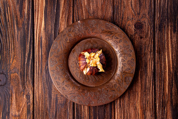 Ripe figs baked with cow's-milk cheese brie and camambert and sprinkled with bread crumbs on vintage cooper plate over on wooden background. Healthy eating concept. top view. copy space