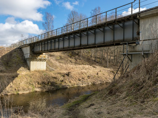 Fototapeta na wymiar railway bridge over the little river.