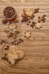 Background with homemade cakes, fragrant cookies. Cookies in the form of hearts, stars, coffee beans, spices, almonds close-up. menu concept, Home baking. Full size
