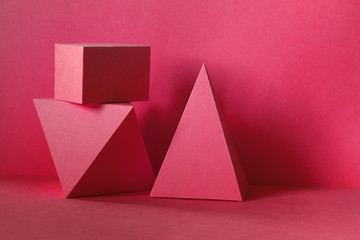 Red abstract geometrical figures background. Beautiful three-dimensional pyramid rectangular cube...