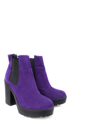 Female violet suede boots on white background, isolated product, top view. heeled shoes