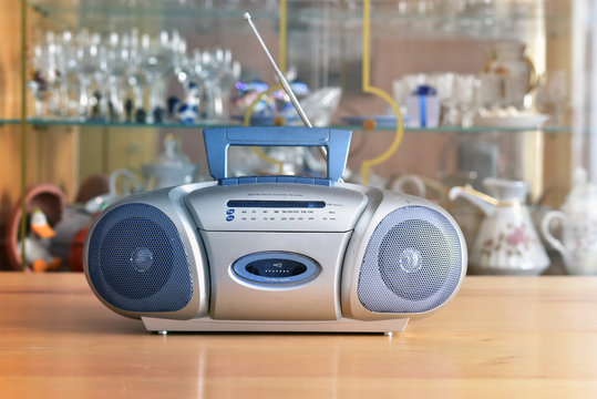 Dusty radio cassette recorder on the blurred background of retro interior - Powered by Adobe
