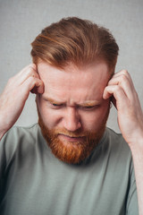 Fototapeta premium bearded man in a headache