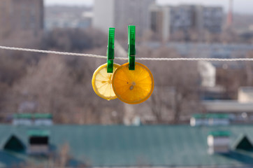 orange and lemon hang on a clothespin