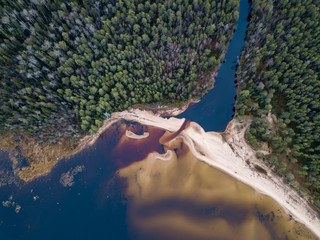 Aerial view on the forest, river mouth and sand beach in Karelia, northwest of Russia