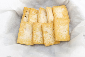Grilled tofu on white background