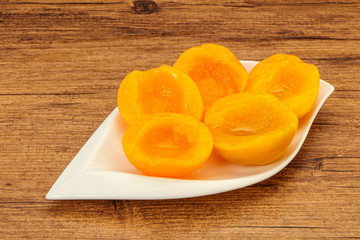 Naklejka na ściany i meble Marinated peaches fruit in the bowl