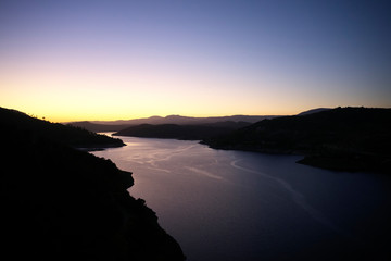 Magnificent view of the Burguillo reservoir at sunset. Popular tourist attraction. Cinematic scene...