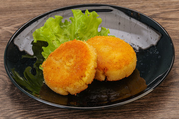 Vegan cuisine - Potato cutlet in the plate