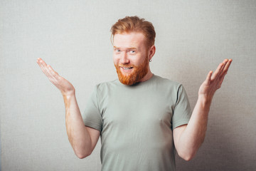 Young hipster red bearded Man with hands in the air