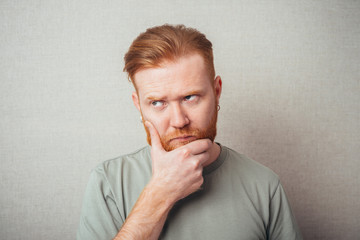 Emotional man keep his mouth closed by his hands