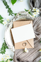 cloth and invitation card in envelope with jasmine flowers and sealing wax. flat lay. wedding...