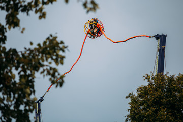 People having fun on a reversed bungee, also called slingshot ride.