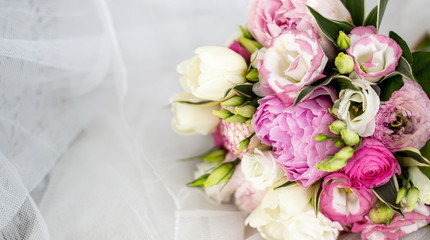 Beautiful wedding bouguet made of white and pink peonies.