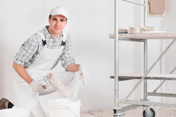 Confident relaxed young painter at work - 339114799