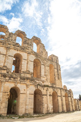 Vertical color photography of exterior of old antique amazing well conserved huge Amphitheatre of El Jem in Tunisia.