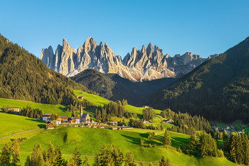 Fototapeta na wymiar Famous alpine place Santa Maddalena village with magical Dolomites mountains in background, Val di Funes valley, Trentino Alto Adige region, Italy