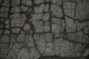 asphalt in cracks texture / abstract background cracks on asphalt road