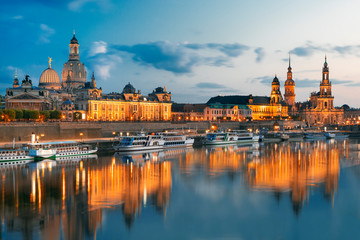 Obraz na płótnie Canvas Dresden city skyline at Elbe river and Augustus bridge at sunset, Dresden, Saxony, Germany