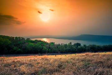 Natural panoramic nature background,high angle viewpoint area, overlooking trees, mountains, large wind turbines,cool wind blurring, abundance of forest