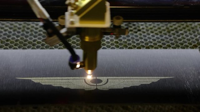 CNC engraving. Laser engraver with cnc, logo engraving laser. Laser engraving on metal