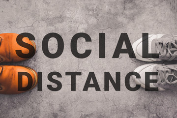 Fototapeta premium Social distance. Person legs stand apart from each other in order to avoid virus infection, epidemic coronavirus