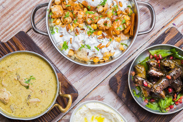 Wooden table with different meals for lunch