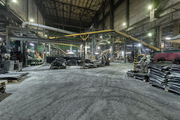 Interior of a factory for manufacturing rubber conveyor belts.