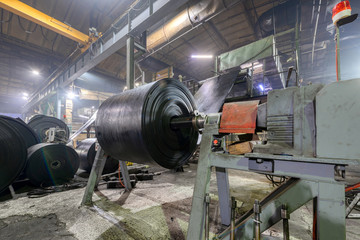 Interior of a factory for manufacturing rubber conveyor belts.