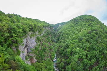 Obraz premium mountain river Okatse in Okatse Canyon in Georgia. distortion perspective fisheye lens view