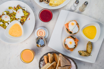 Table with poached eggs and bread for breakfast
