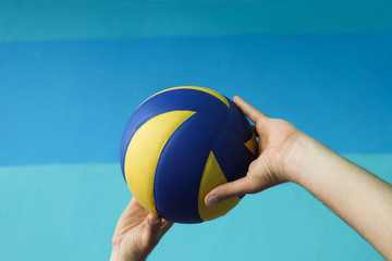 Volleyball competition, the player holds the ball before the start of the game, team sport in the...