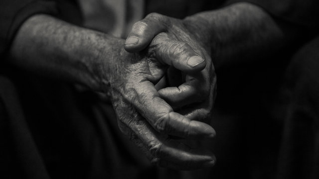 Black and white photo of elderly man's hands