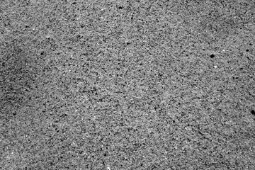 Beach sea sand close-up in black and white.