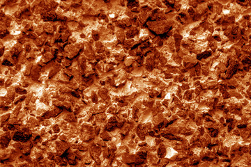 Old stone surface in orange tone.