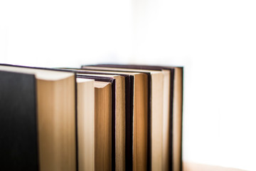 Stack of antique hard cover books