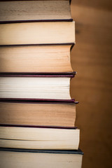 Stack of antique hard cover books
