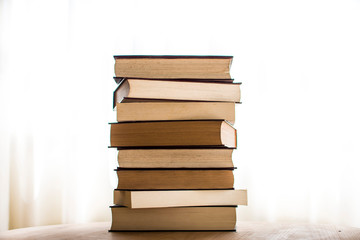 Stack of antique hard cover books