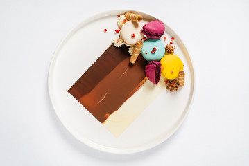 gourmet dessert with macaroons and chocolate